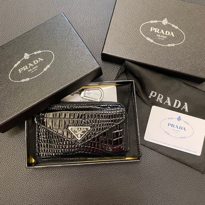 A top-down view of a navy PRADA Classic Card Holder Wallet showcasing its clean lines and minimalist design.