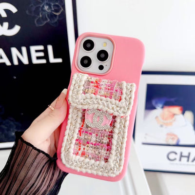 Close-up of Chanel iPhone case with integrated fabric card holder