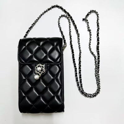 Close-Up of Chanel Logo on Luxury Phone Bag