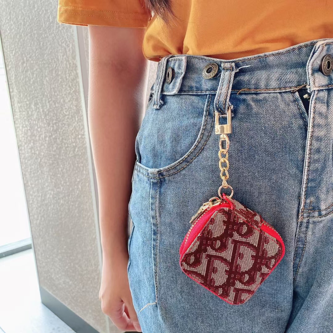 Side view of the Luxury Dior AirPods Case &amp; Bag highlighting its compact size and sleek design