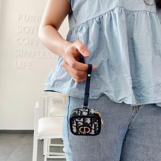 Open Dior AirPods Case &amp; Bag showing interior