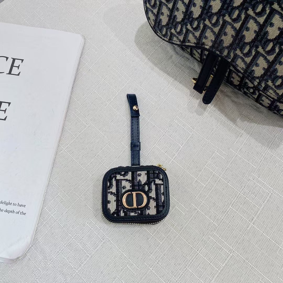Dior AirPods Case &amp; Bag on stylish surface