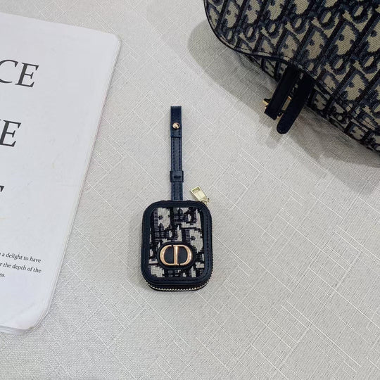 Dior AirPods Case &amp; Bag on stylish surface