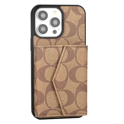 Interior view of Coach iPhone Case with built-in wallet, displaying multiple card slots and sleek leather