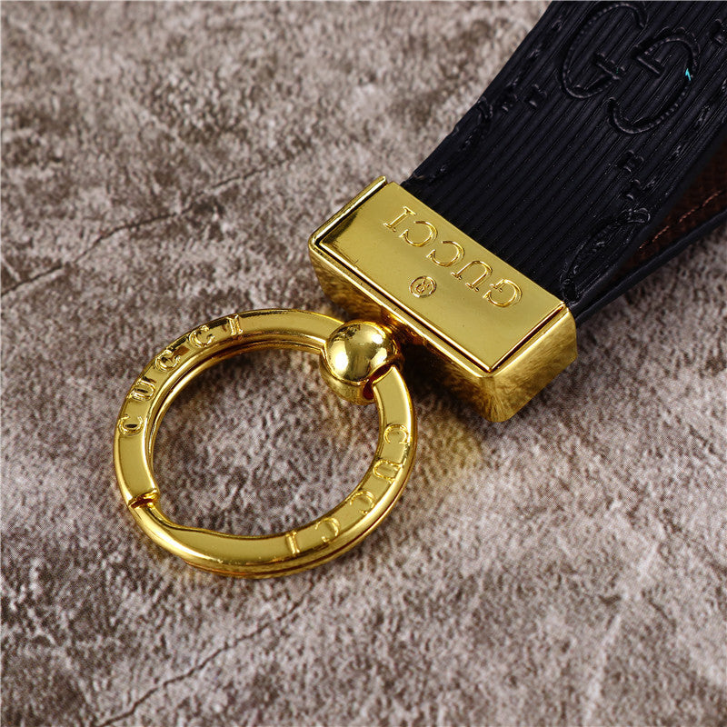 Gucci Keychain featuring the iconic logo and luxurious design, displayed against a neutral backdro