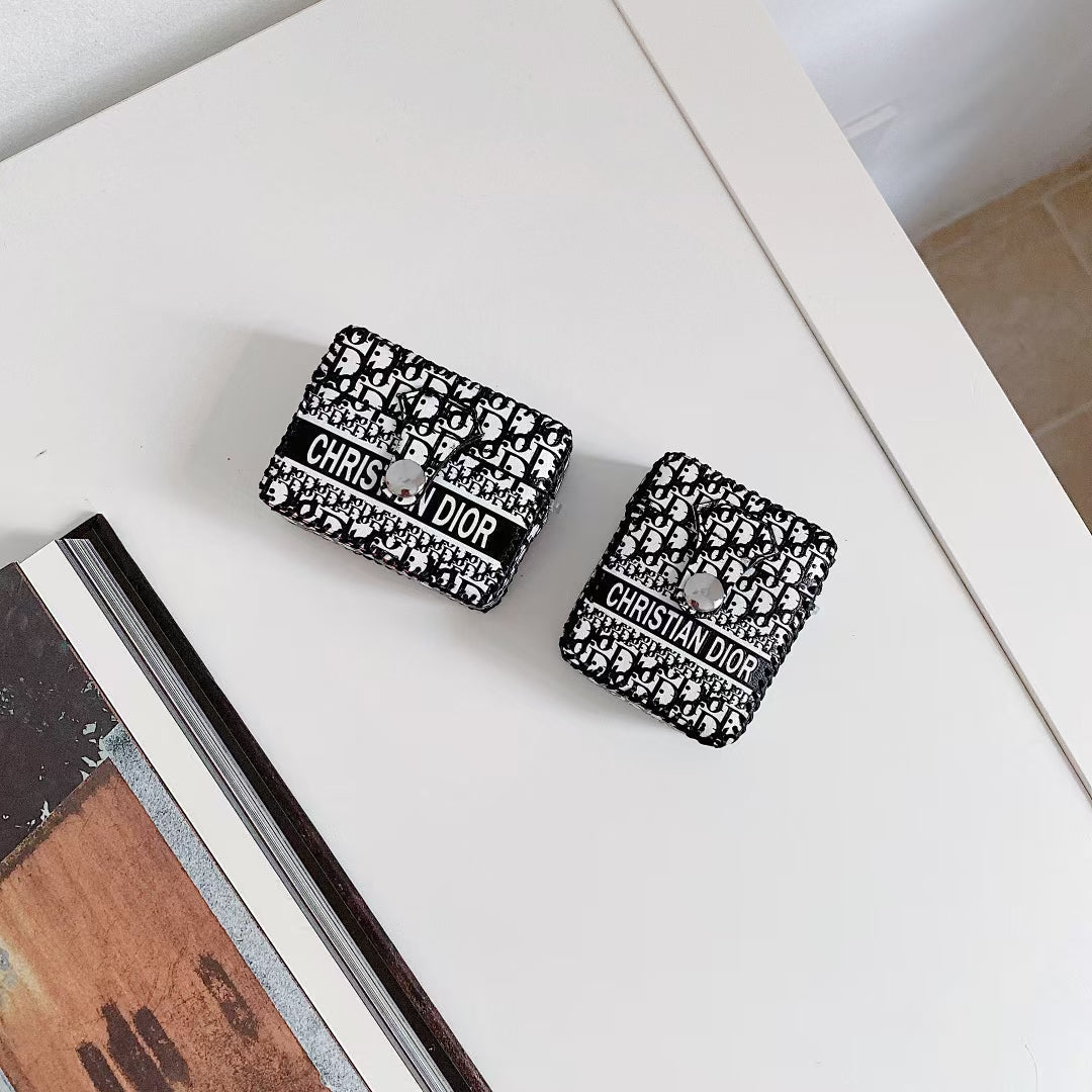 Dior Premier Chic AirPods Case with iconic logo on a white background