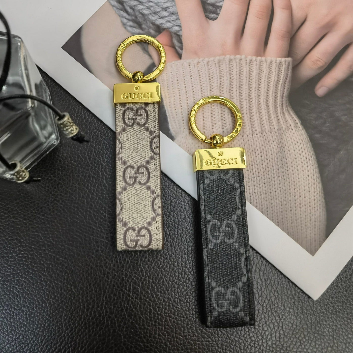 Gucci Keychain displayed on a sleek, modern background to highlight its luxury design