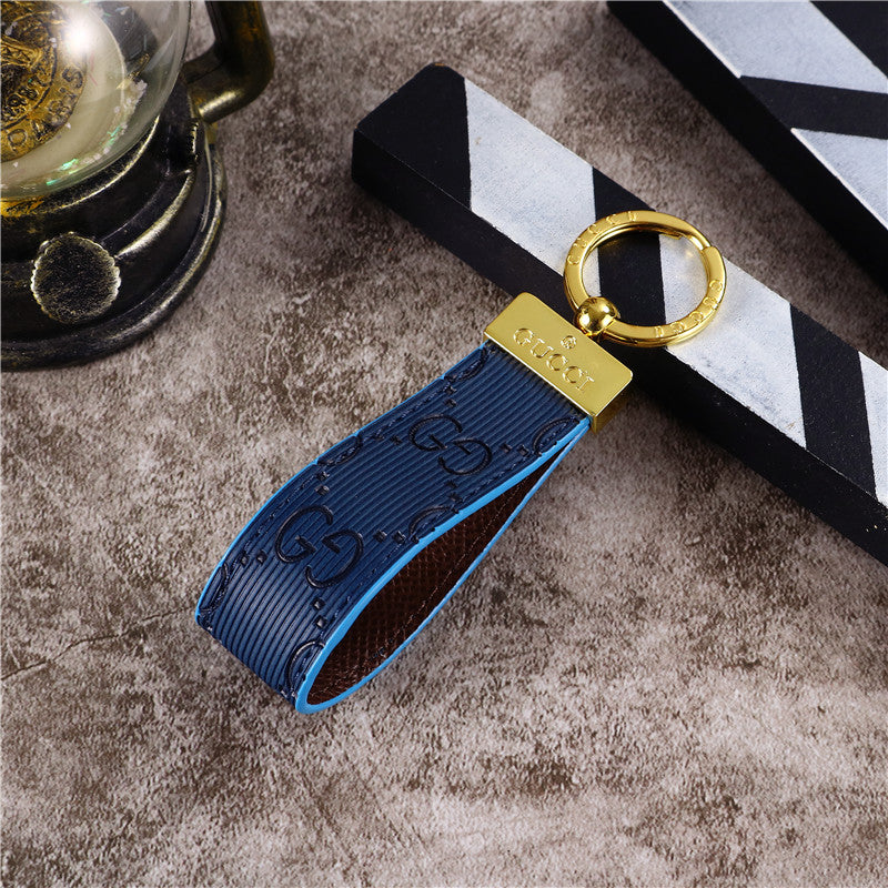 Gucci Keychain with a close-up of its sleek, modern design and high-quality details