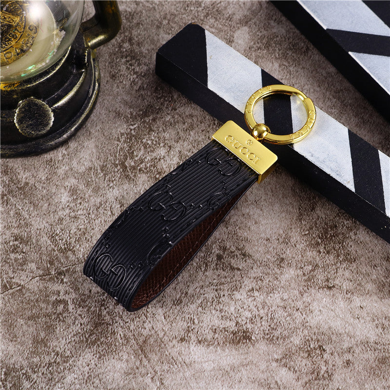 Elegant Gucci Keychain on a minimalist surface, highlighting its chic appearance and refined style