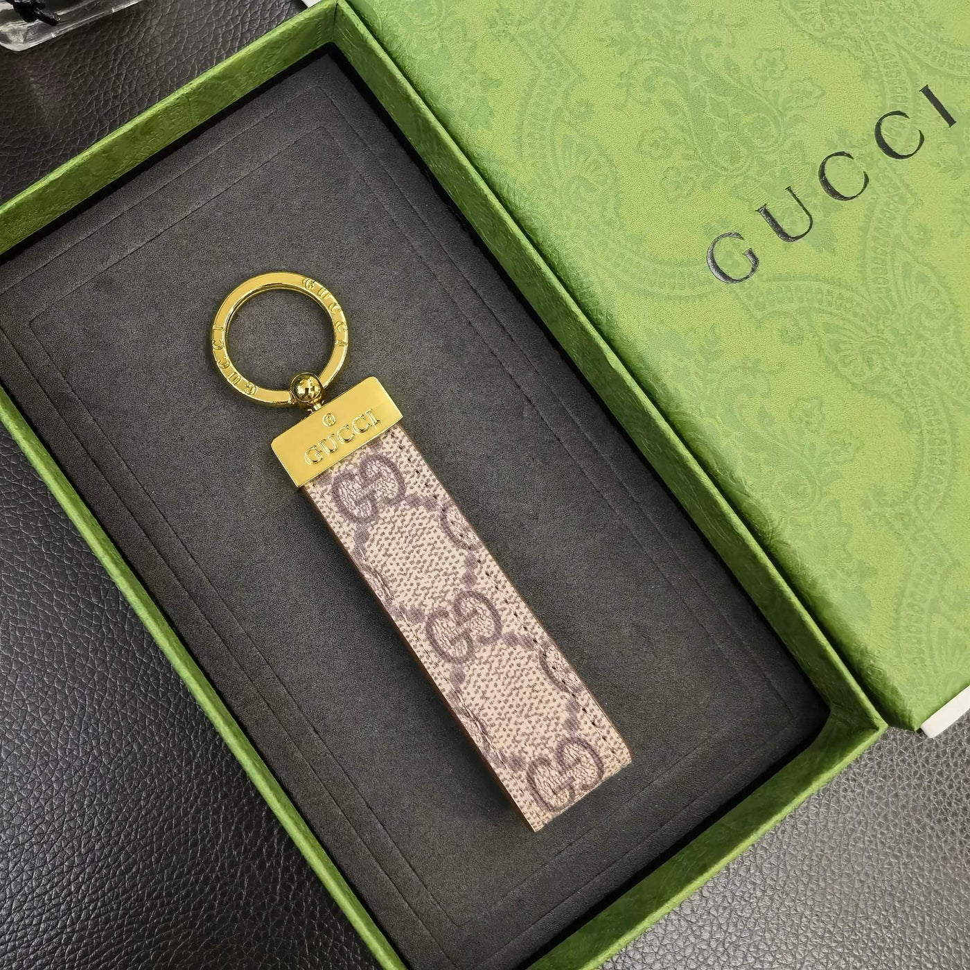 Elegant Gucci Keychain with a close-up of its refined finish and logo