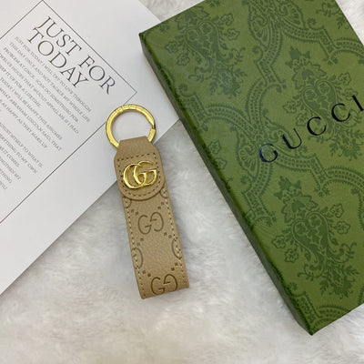 Gucci Keychain presented in elegant packaging, ideal for gifting