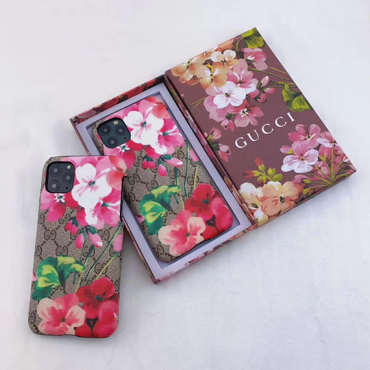 Stylish Gucci phone case with iconic blooms pattern