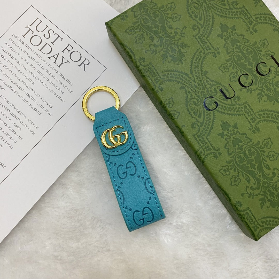 Chic Gucci Keychain with a close-up of its refined design and logo"