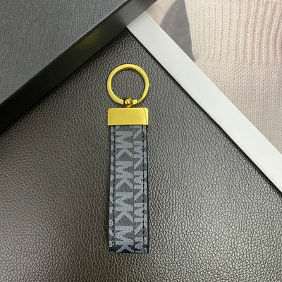 Michael Kors keychain nestled in luxury packaging