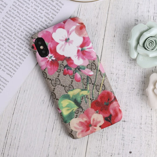 Designer Gucci iPhone case with vibrant blooms design