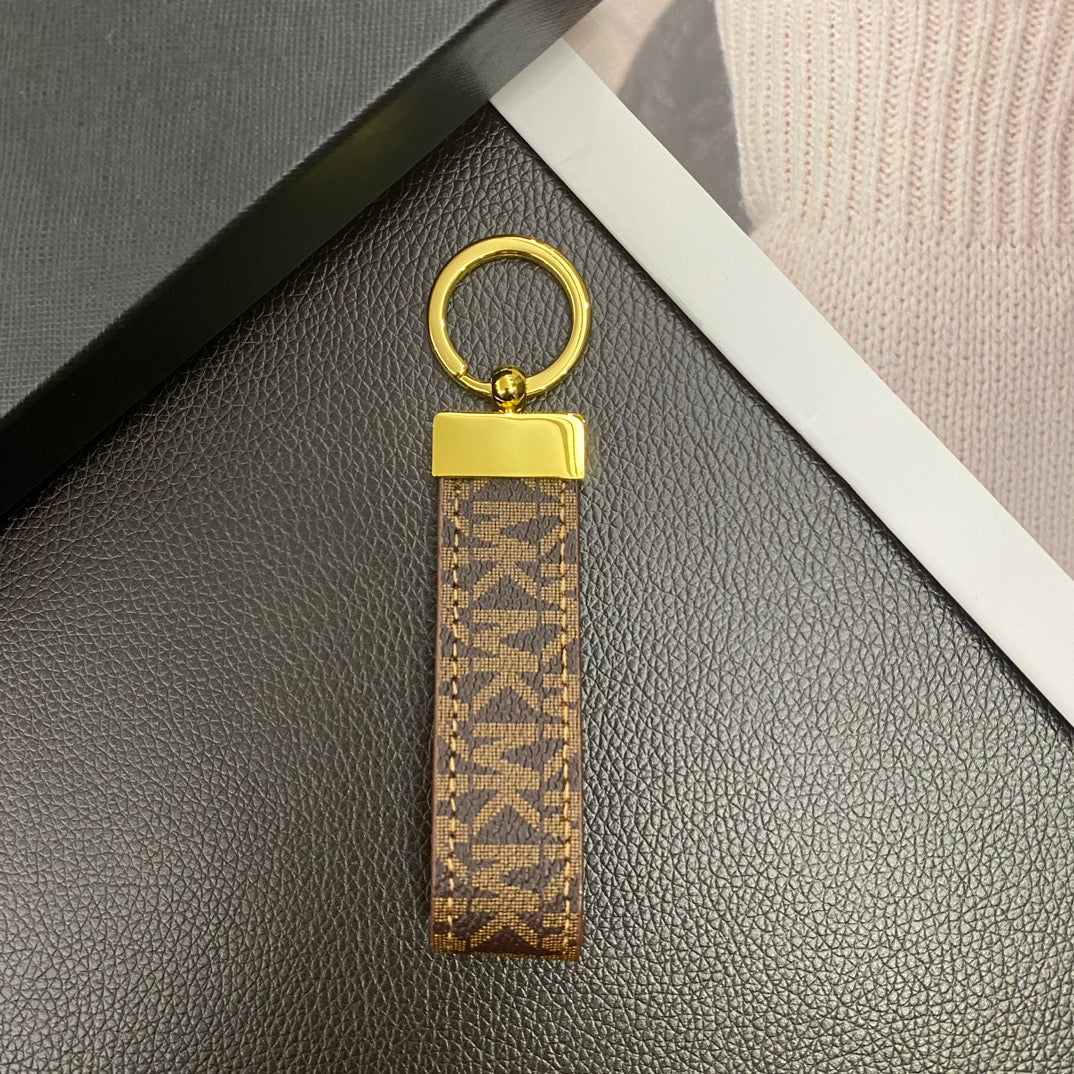 Keychain attached to a stylish handbag