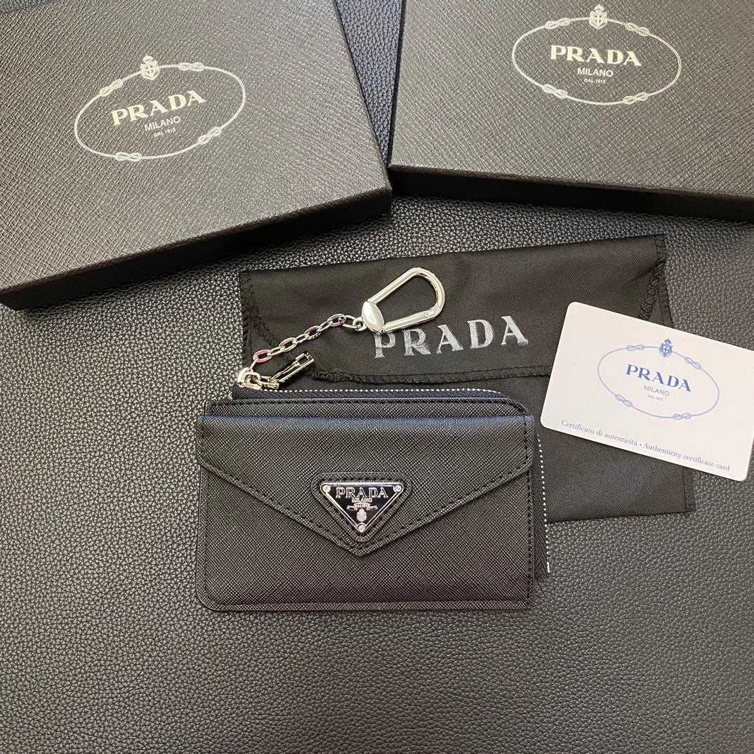 A close-up of the interior of a PRADA Classic Card Holder Wallet, revealing multiple card slots and a central compartment for bills.