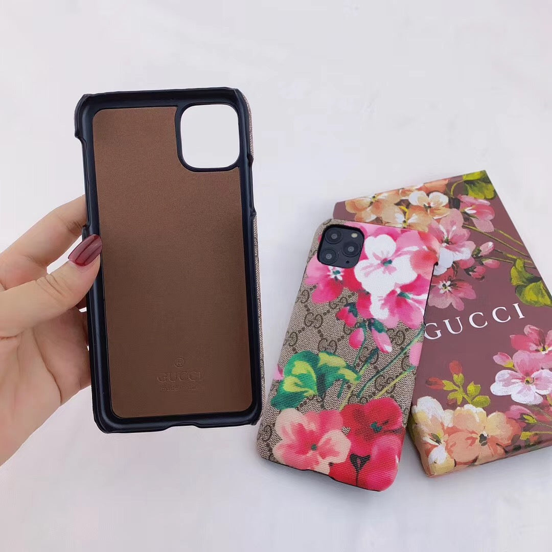 Designer Gucci iPhone case with vibrant blooms design