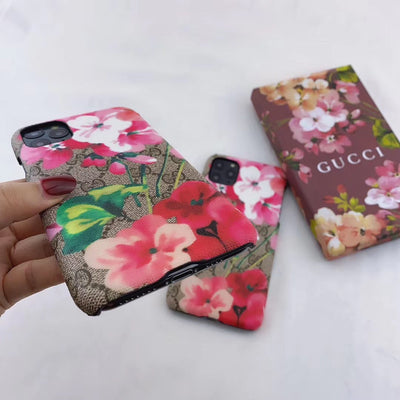 Designer Gucci iPhone case with vibrant blooms design